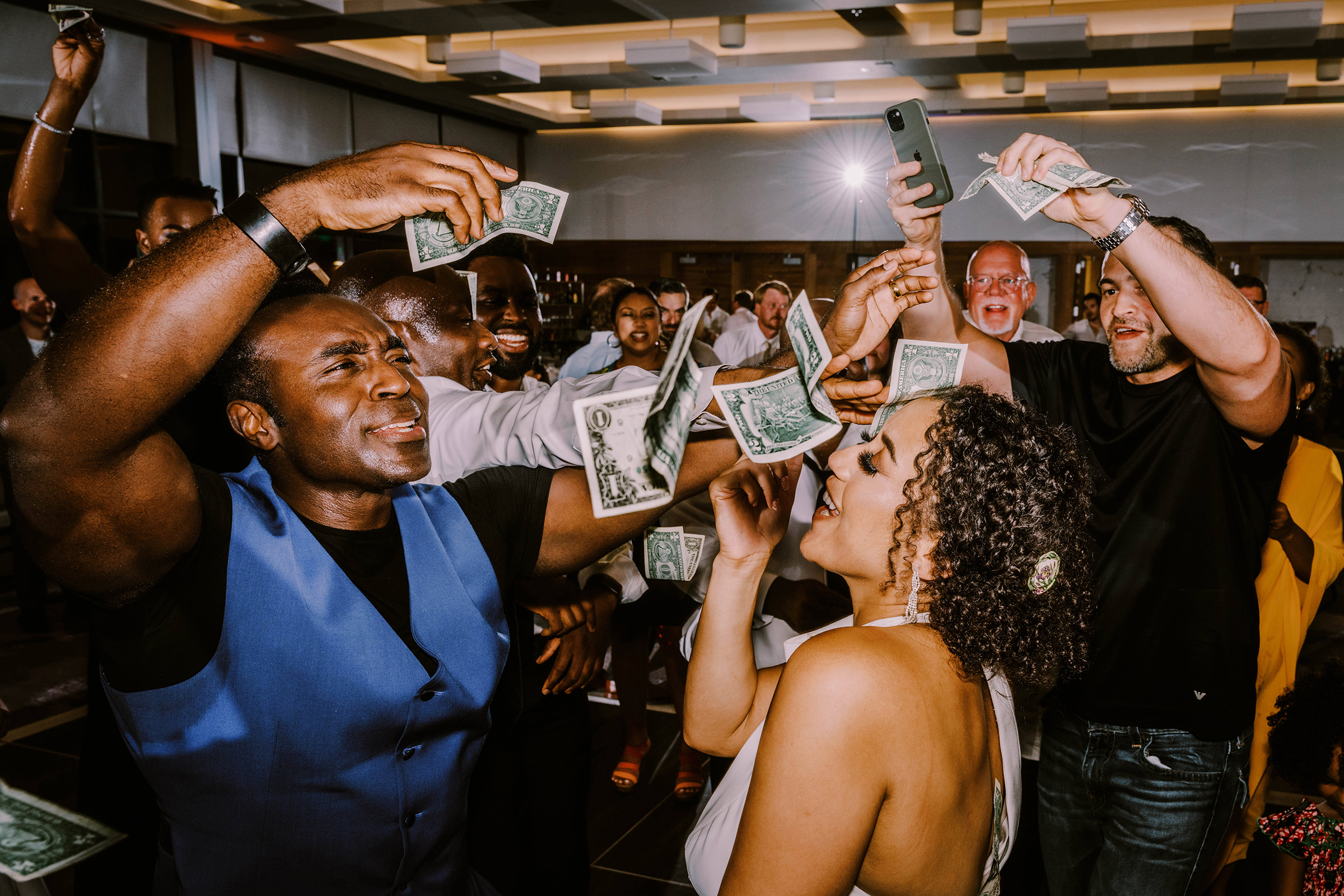 Money dance at Kasi and Sada's Hyatt Regency Lake Washington wedding, Summer 2022