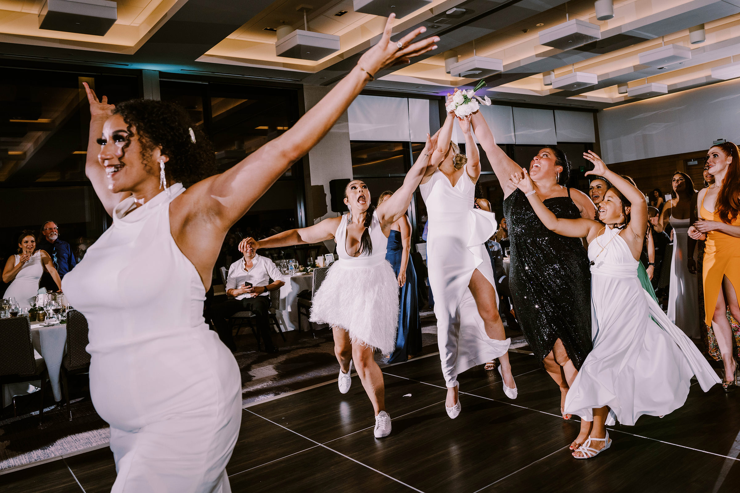 Epic bouquet toss at Kasi and Sada's Hyatt Regency Lake Washington wedding, Summer 2022
